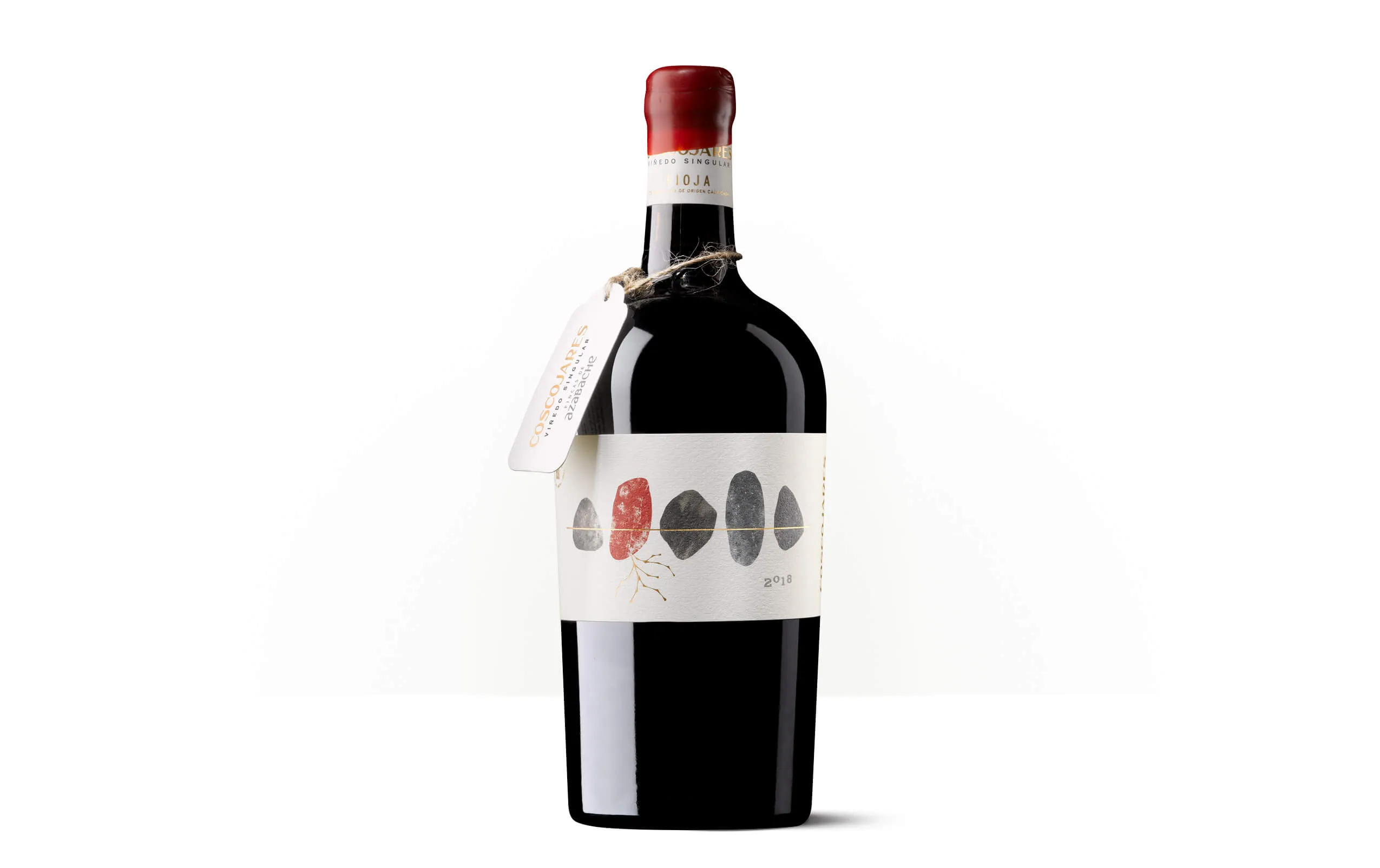 Silueta de una botella de Coscojares, vino de Garnacha de Viñedos de Aldeanueva, con etiqueta ilustrada de piedras y racimos.