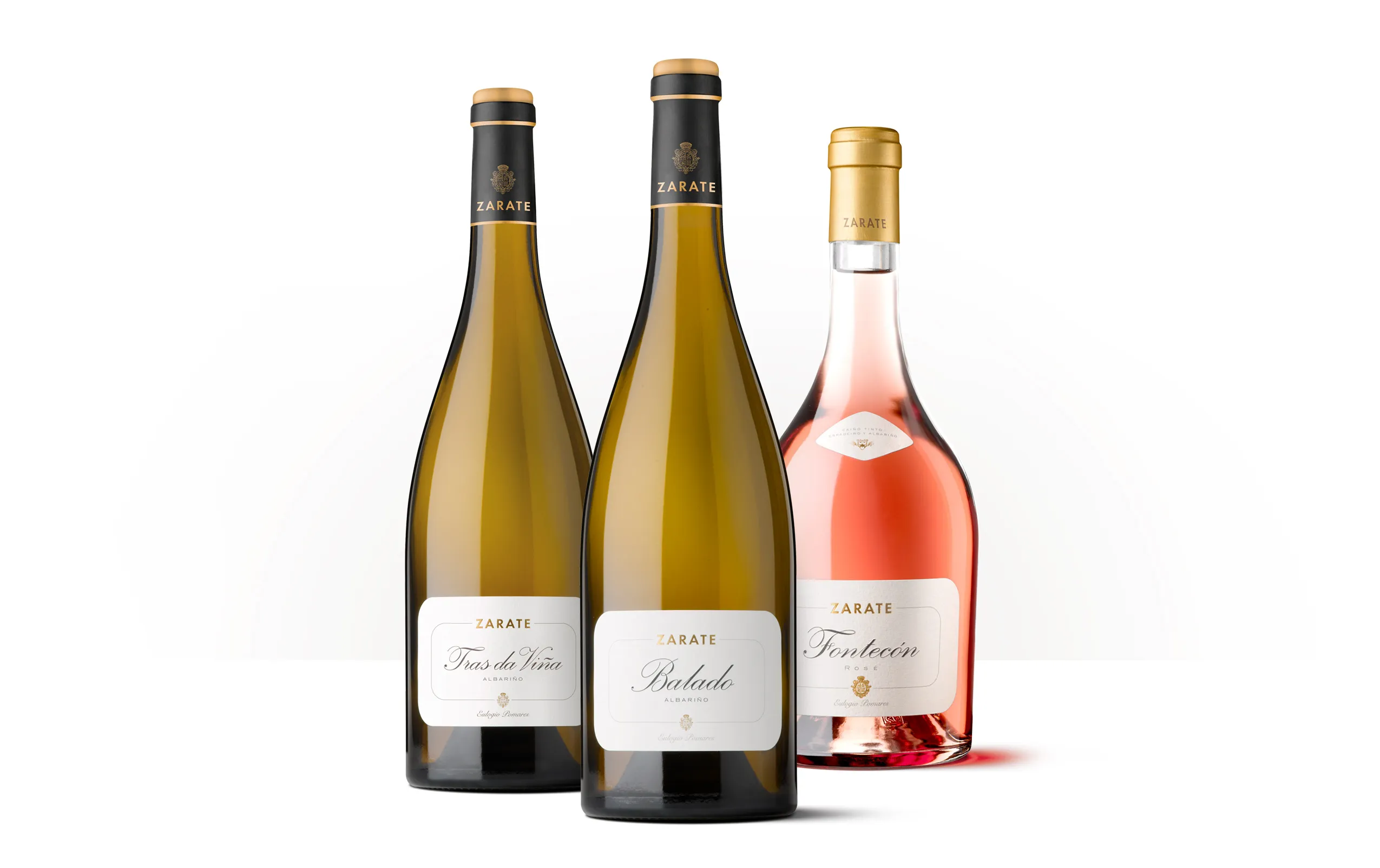 Siluetas de tres botellas de Zarate: dos vinos blancos y un rosado de la bodega gallega.